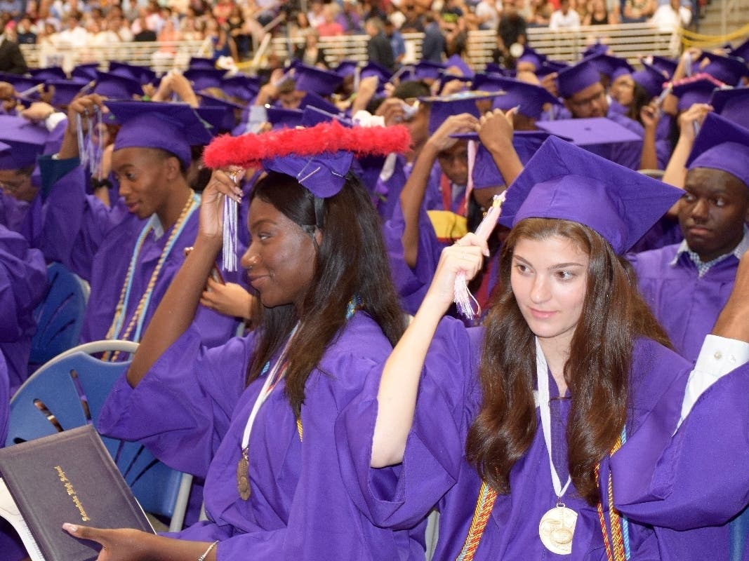 Sewanhaka High School graduates moved their tassels on their caps to signify their graduation.