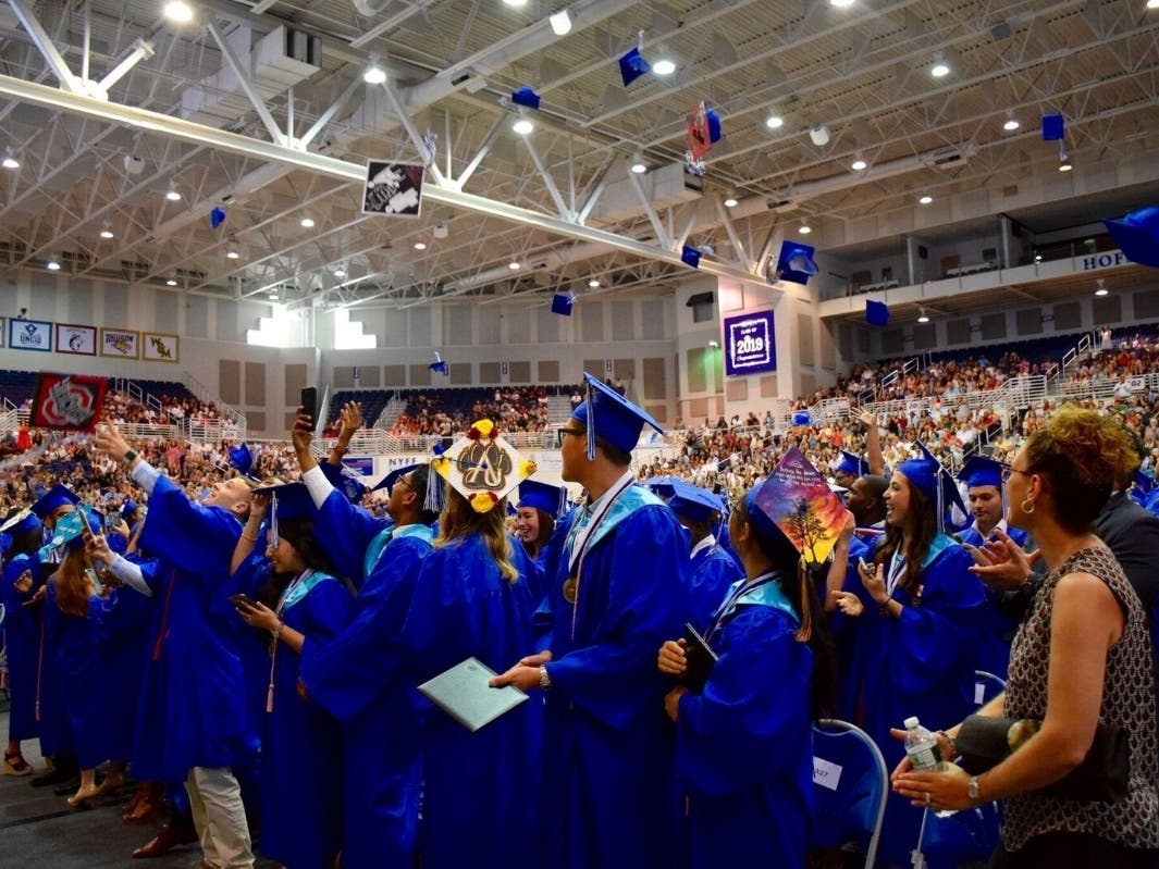 New Hyde Park Memorial High School graduates tossed their caps in celebration.