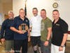 Bill Faltin is presented an award by the Town of Huntington Fire Chiefs Council executive board. 