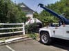 A woman drove through a fence and into a creek in Huntington.