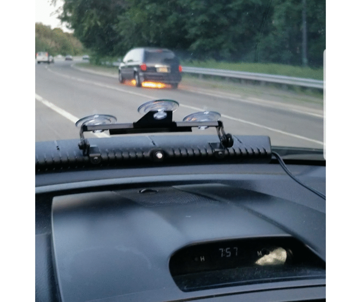 The view of the minivan starting to catch fire from Joseph Ryder's car.