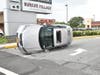 A car overturned in Hicksville following a collision Tuesday morning. Two were injured.
