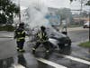 Plainview fire fighters work to extinguish the flames of the car that was on fire.