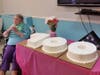 Adele Gordon in front of her birthday cakes.