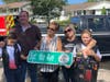 Sergeant Ike's family holds the new street sign.