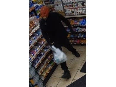 A man wearing a Halloween mask robbed a Centereach gas station on Tuesday morning.