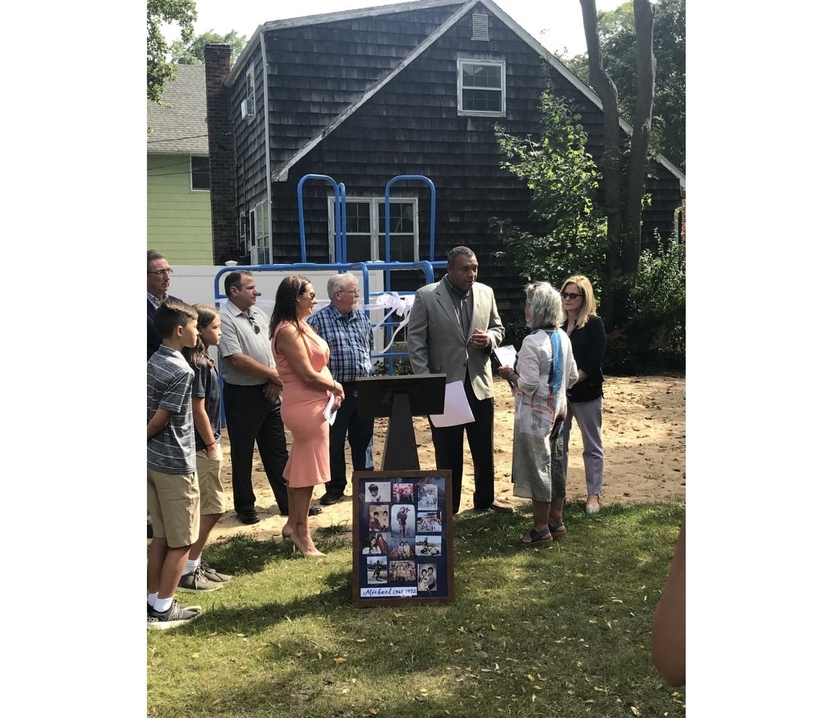 Legislator William R. Spencer presented Maxine DeSeta a proclamation in recognition of her donation honoring her late son Michael Budelis.