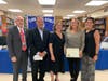 Carla Weiss accepted an award on behalf of the board of education for her exceptional devotion to the Elwood Union Free School District.