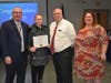 From left, Superintendent of Schools Robert Banzer, Northport High School student Kate Hecker, Board of Education President David Badanes and District Chairperson for World Languages and ENL Jennifer Nesfield.