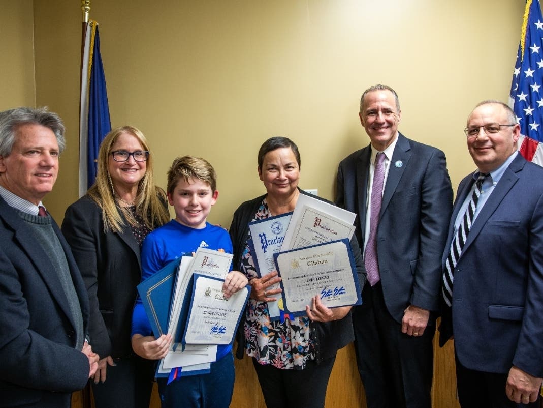 L-R: Bob Lopez, senior adviser to State Senator Jim Gaughran, Legislator Susan A. Berland, Hunter Javeline, Janie Lozano, Half Hollow Hills Central School District Superintendent Dr. Patrick Harrigan and Board of Education President Eric Geringswald. 