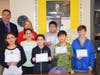 From left, Port Jefferson Middle School sixth graders Elizabeth Campo, Victoria Snaden, Max Kronberg, Kevin Hong, Christopher Nam and Lucas Sweeney with Principal Dr. Robert Neidig and math teacher Meg Ryan.
