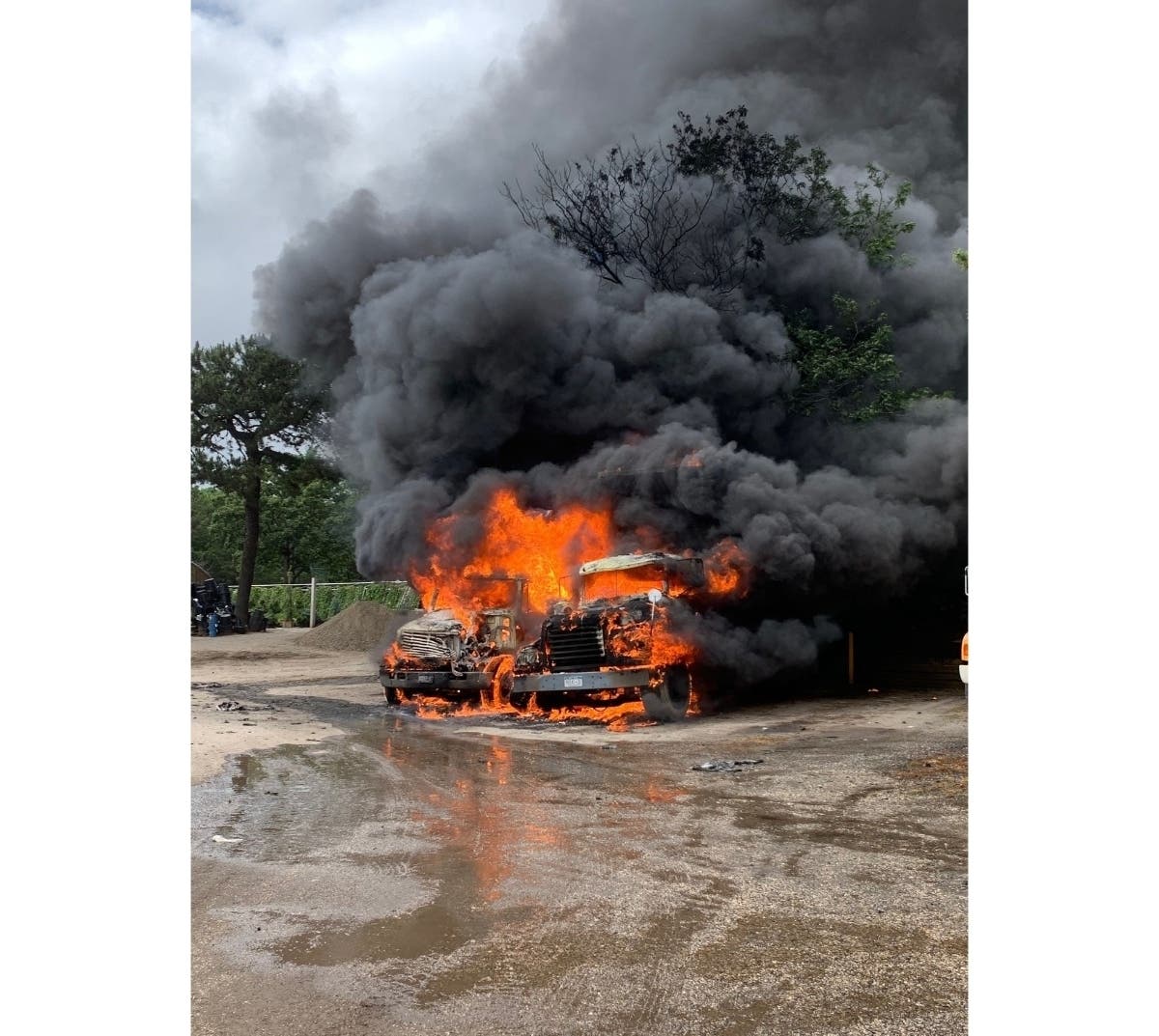 Two dump trucks caught fire at North Service Nursery in Melville on Thursday, prompting Melville Fire Department to respond and douse the flames.
