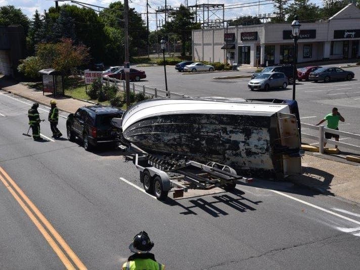 A boat fell off a trailer and into the road on Hempstead Turnpike by Merritts Road in Farmingdale on Tuesday afternoon.
