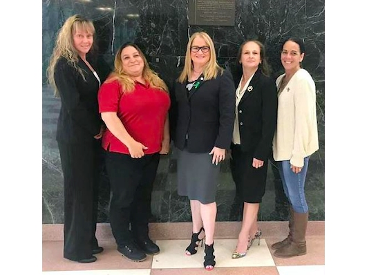 L-R: SC Women Veterans Advisory Board Chairwoman Christine Glynn, USMC, Vice Chairwoman StaceyAnn Castro Tapler, USMC, Legislator Susan A. Berland, Women Veterans Appreciation Day honoree Magda Resker, USMC, and Board member Cathie Norton Doherty, USN.