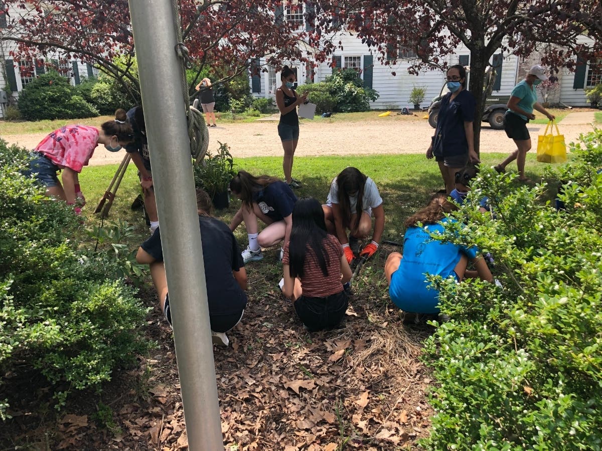 Town of Smithtown Youth Bureau volunteers participate in a beautification project at Sweetbriar Nature Center in Smithtown on July 30. 