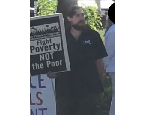 A man harassed another man at a political rally in Setauket on Sept. 12, Suffolk police said.