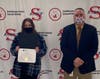 Smithtown High School East student Kaylee Gallagher received awards from the National School Development Council for Academic Growth and Student Leadership in Learning. She is pictured with Smithtown High School East Principal Dr. Kevin Simmons.