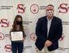 Smithtown High School East student Abigail Thaw received awards from the National School Development Council for Academic Growth and Student Leadership in Learning. She is pictured with Smithtown High School East Principal Dr. Kevin Simmons.