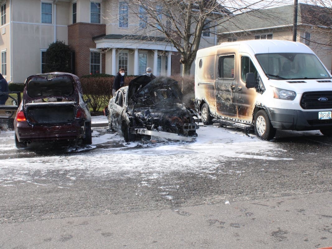 Vehicles caught fire in a Melville parking lot Friday.