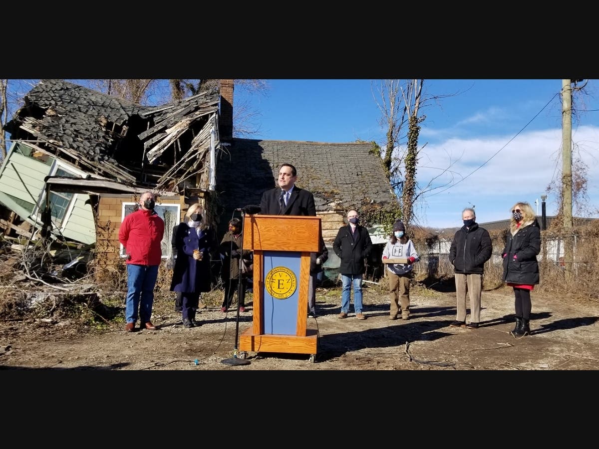 Supervisor Chad A. Lupinacci speaks at a press conference in front of Peter Crippen House on Friday.
