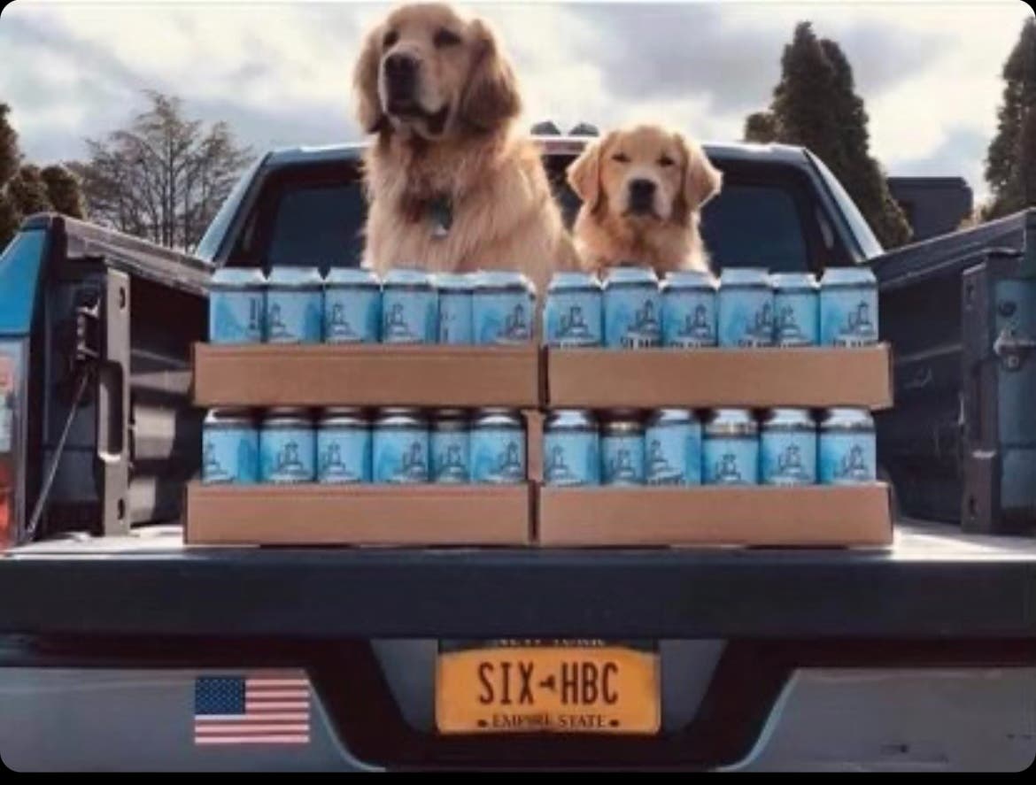 Buddy and Barley on a beer delivery mission for Huntington's Six Harbors Brewing Company.