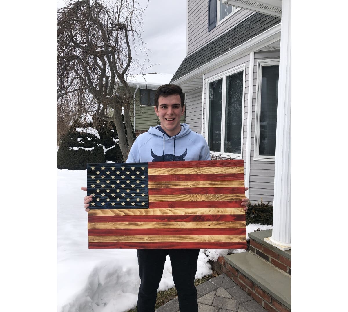 Stony Brook School junior Bobby Reuter has been hand-crafting wooden American
flags to send to members of congress as a symbol of American unity.