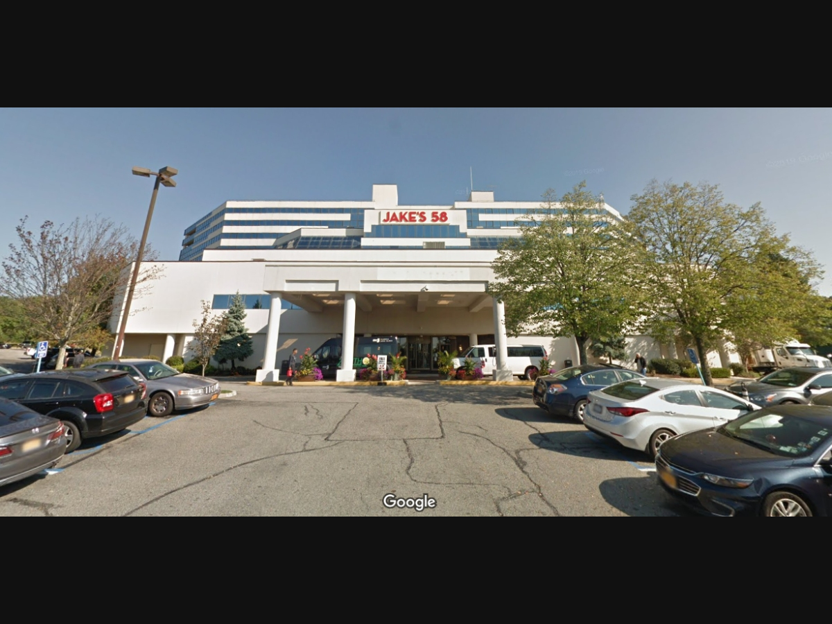 A woman was robbed at gunpoint by a man in the Jake's 58 parking lot on Tuesday night, Suffolk police said.