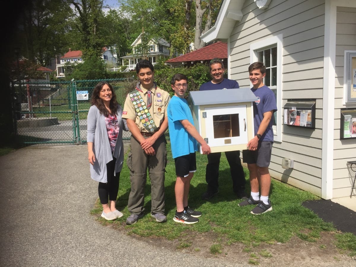 Michael Mondo of Northport and his family are shown with the free library structure he made as an Eagle Scout community project.