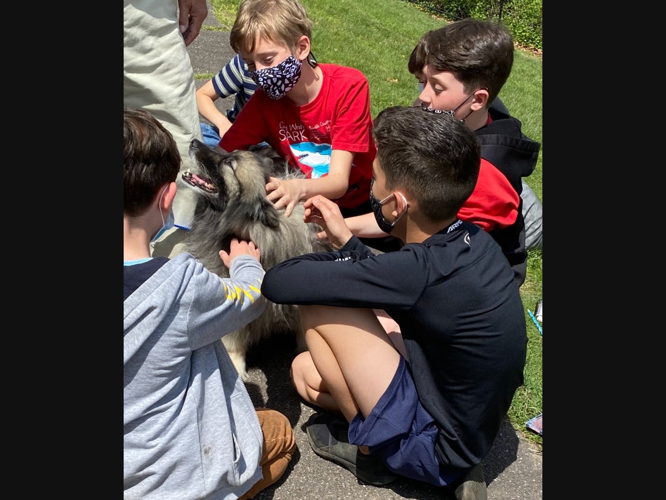 Edna Louise Spear Elementary School students met Ray, a therapy dog.