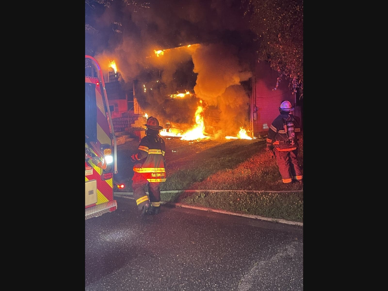 Greenlawn firefighters battle a house fire early Thursday morning.