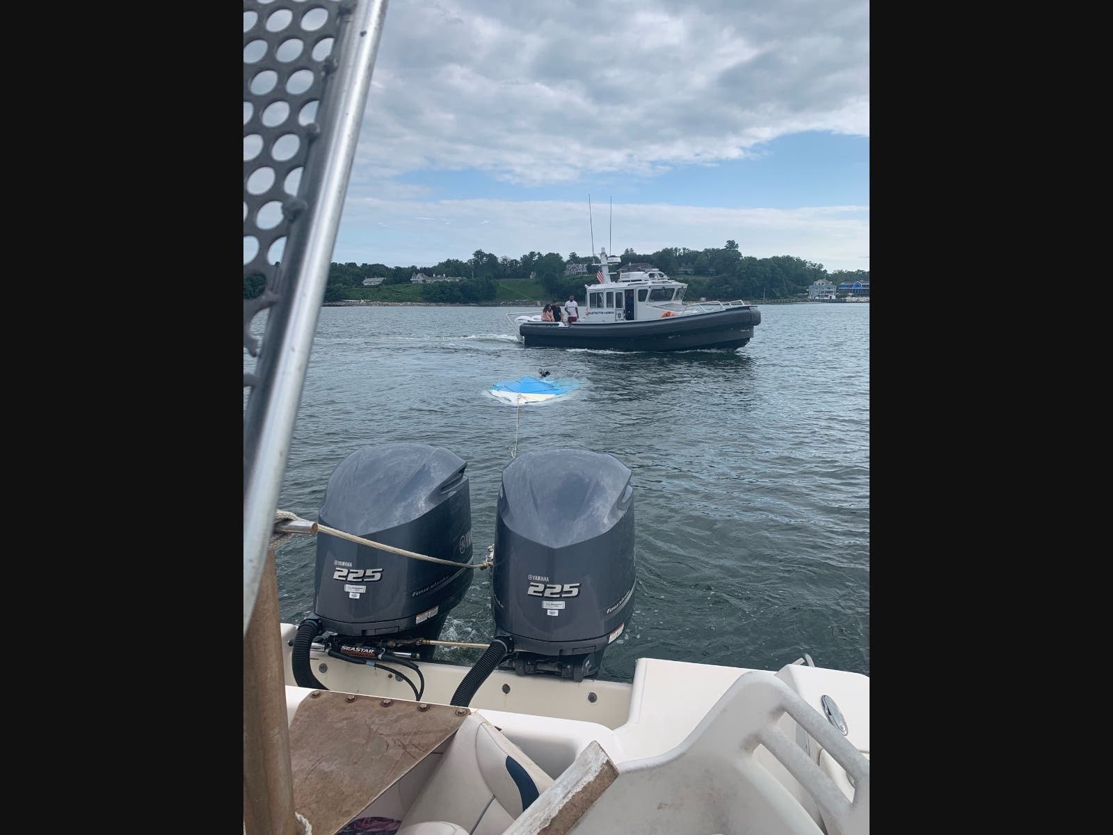 Town of Huntington Harbormaster response boat Marine 3 towing the overturned vessel with Marine 1 transporting rescued boaters on Sunday.