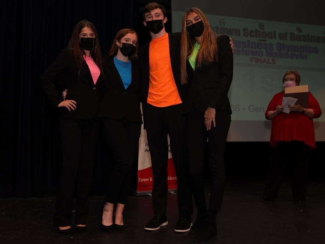 “Gen Zillionaires” team members make their pitch for a retro entertainment center and celebrated their victory.