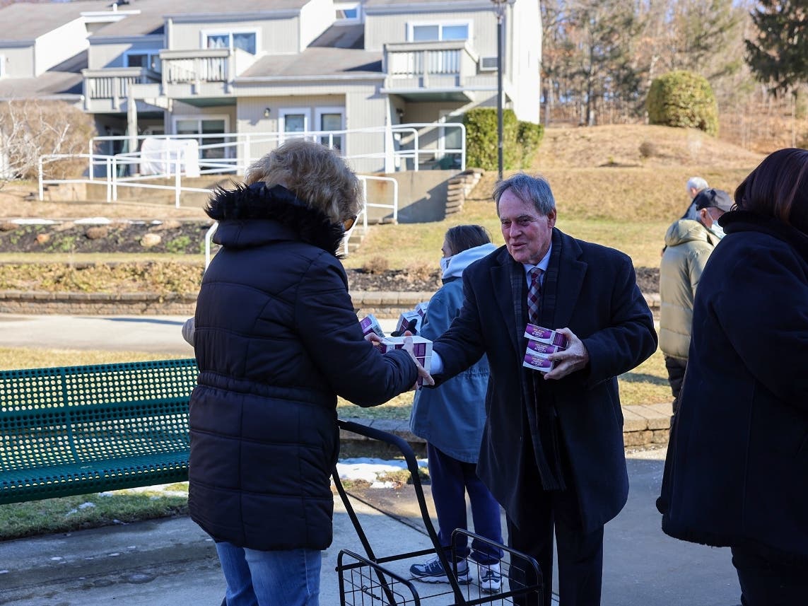 Supervisor Edward Wehrheim (pictured) and Councilman Tom Lohmann distribute at-home coronavirus test kits at Sienna Village in Smithtown.