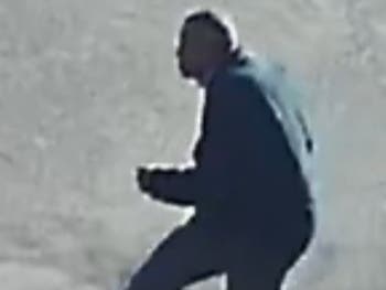 A man is wanted for robbing a woman in Commack in February, Suffolk police said.