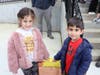 Daly Pre-K students place drawings in the time capsule.