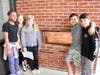 Fifth-grade students from Daly Elementary School place mementos in the time capsule in the new wing of their school.