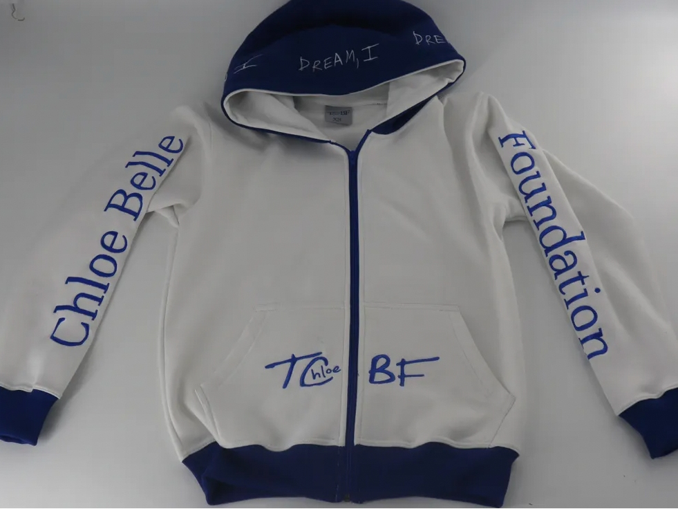 The Chloe Belle Foundation's Endless Summer Nights zip-up sweatshirt. The hoodie is one of several items in the nonprofit's Eighties Beach House Collection.