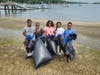 Volunteers clean the Centerport Senior Beach House on Saturday.