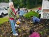 Volunteers clean the Centerport Senior Beach House on Saturday.
