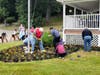 Volunteers clean the Centerport Senior Beach House on Saturday.