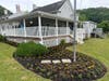 Volunteers clean the Centerport Senior Beach House on Saturday.