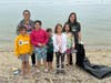 Volunteers clean the Centerport Senior Beach House on Saturday.