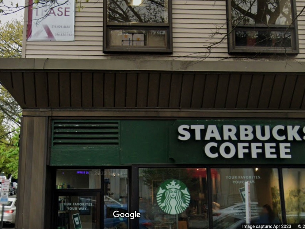 A man tossed a hot cup of coffee and used an anti-gay slur toward a man outside a Starbucks in Port Washington on Saturday, Port Washington police said.
