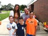 New Smithtown Elementary School Principal Dr. Mary-Ellen Kakalos (top left) meets a family.