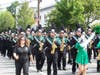Gina Pellettiere, the director of the Farmingdale High School marching band and wind ensemble, marches with her students during a parade.