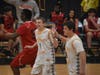 Northport High School students Christian Sloan and Brandon Mont high five after scoring points during a Unified Basketball Game.