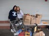 Two freshmen help collect food and supply donations at Stop & Shop for Northport High School’s Ramon’s Place Food Pantry.