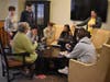 Northport High School freshman play board games with residents at the Atria Senior Living facility.