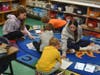Northport High School students work alongside elementary-aged students as part of their community service initiative.