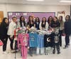 Walt Whitman HS GLO members with collected pajamas for donation to Huntington Hospital and South Huntington families.